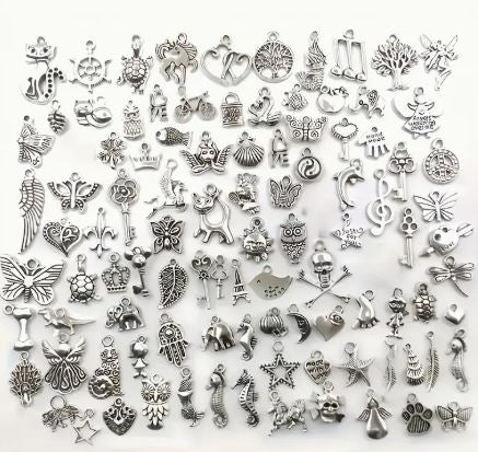 Collection of various silver charms 